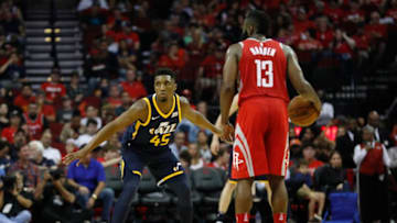 HOUSTON, TX - NOVEMBER 05: James Harden #13 of the Houston Rockets controls the ball defended by Donovan Mitchell #45 of the Utah Jazz in the first half at Toyota Center on November 5, 2017 in Houston, Texas. (Photo by Tim Warner/Getty Images)