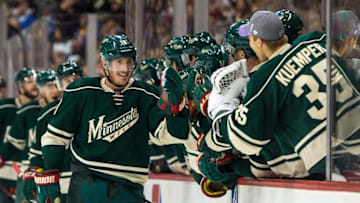 Oct 30, 2015; Saint Paul, MN, USA; Minnesota Wild forward Ryan Carter (18) celebrates his goal with teammates during the first period against the Chicago Blackhawks at Xcel Energy Center. Mandatory Credit: Brace Hemmelgarn-USA TODAY Sports