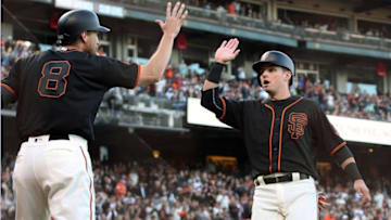 Aug 13, 2016; San Francisco, CA, USA; San Francisco Giants right fielder Hunter Pence (8) greets second baseman Joe Panik (12) after they both scored on a two run base hit by center fielder Denard Span (2) (not pictured) in the second inning of their MLB baseball game with the Baltimore Orioles at AT&T Park. Mandatory Credit: Lance Iversen-USA TODAY Sports