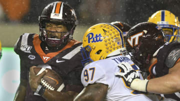 BLACKSBURG, VA - NOVEMBER 23: Quarterback Hendon Hooker #2 of the Virginia Tech Hokies is hit by defensive lineman Jaylen Twyman #97 of the Pittsburgh Panthers in the second half at Lane Stadium on November 23, 2019 in Blacksburg, Virginia. (Photo by Michael Shroyer/Getty Images)