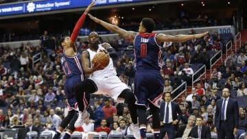 Jan 3, 2016; Washington, DC, USA; Miami Heat guard Dwyane Wade (3) shoots the ball as Washington Wizards guard Garrett Temple (17) and Wizards guard Jarell Eddie (8) defend in the second quarter at Verizon Center. Mandatory Credit: Geoff Burke-USA TODAY Sports