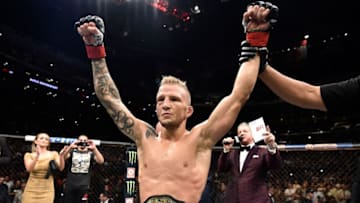 LOS ANGELES, CA - AUGUST 04: TJ Dillashaw celebrates after his knockout victory over Cody Garbrandt in their UFC bantamweight championship fight during the UFC 227 event inside Staples Center on August 4, 2018 in Los Angeles, California. (Photo by Jeff Bottari/Zuffa LLC/Zuffa LLC via Getty Images)