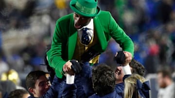 DURHAM, NORTH CAROLINA - NOVEMBER 09: The Notre Dame Fighting Irish leprechaun mascot performs push-ups after a touchdown against the Duke Blue Devils during the fourth quarter of their game at Wallace Wade Stadium on November 09, 2019 in Durham, North Carolina. (Photo by Grant Halverson/Getty Images)
