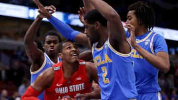 CHICAGO, ILLINOIS - DECEMBER 22: Kaleb Wesson #34 of the Ohio State Buckeyes dribbles the ball while being guarded by Moses Brown #1 and Cody Riley #2 of the UCLA Bruins in the first half during the CBS Sports Classic at the United Center on December 22, 2018 in Chicago, Illinois. (Photo by Dylan Buell/Getty Images)