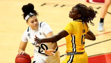 Cincinnati Bearcats guard Jillian Hayes drives the lane against Wichita State Shockers at Fifth Third Arena. The Enquirer.