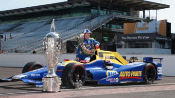 May 30, 2016; Indianapolis, IN, USA; Verizon Indy Car driver and 2016 Indy 500 winner Alexander Rossi poses for a photo in his car at the yard of bricks at the Indianapolis Motor Speedway. Mandatory Credit: Brian Spurlock-USA TODAY Sports