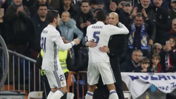 MADRID, SPAIN - JANUARY 04: Raphael Varane (C) of Real Madrid celebrates with head coach Zinedine Zidane (R) after scoring their team's second goal during the Copa del Rey round of 16 first leg match between Real Madrid CF and Sevilla at Estadio Santiago Bernabeu on January 4, 2017 in Madrid, Spain. (Photo by Angel Martinez/Real Madrid via Getty Images)