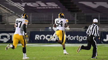 Nov 21, 2020; University Park, Pennsylvania, USA; Iowa Hawkeyes defensive tackle Daviyon Nixon (54) returns an interception for a touchdown against the Penn State Nittany Lions during the fourth quarter at Beaver Stadium. Mandatory Credit: Rich Barnes-USA TODAY Sports