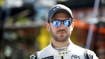 HOMESTEAD, FL - NOVEMBER 17: Daniel Suarez, driver of the #19 ARRIS Toyota, stands in the garage area during practice for the Monster Energy NASCAR Cup Series Ford EcoBoost 400 at Homestead-Miami Speedway on November 17, 2018 in Homestead, Florida. (Photo by Chris Graythen/Getty Images)