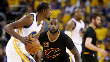 OAKLAND, CA - JUNE 12: LeBron James #23 of the Cleveland Cavaliers defends Kevin Durant #35 of the Golden State Warriors in Game 5 of the 2017 NBA Finals at ORACLE Arena on June 12, 2017 in Oakland, California. NOTE TO USER: User expressly acknowledges and agrees that, by downloading and or using this photograph, User is consenting to the terms and conditions of the Getty Images License Agreement. (Photo by Ezra Shaw/Getty Images)