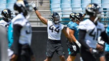 Jaguars first round draft pick (44) OLB Travon Walker warms up with teammates Friday afternoon during Rookie Minicamp. The Jacksonville Jaguars held their first Rookie Minicamp on the turf of TIAA Bank Field Friday afternoon, May 13, 2022. Among those in attendance were the team's 2022 draft picks.Jki 051322 Jagsrookieminicamp 01