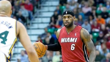 Feb 8, 2014; Salt Lake City, UT, USA; Miami Heat small forward LeBron James (6) dribbles the ball while defended by Utah Jazz small forward Richard Jefferson (24) during the first half at EnergySolutions Arena. Mandatory Credit: Russ Isabella-USA TODAY Sports