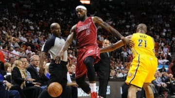 Dec 18, 2013; Miami, FL, USA; Miami Heat small forward LeBron James (6) is pushed by Indiana Pacers power forward David West (21) during the first half at American Airlines Arena. Mandatory Credit: Steve Mitchell-USA TODAY Sports