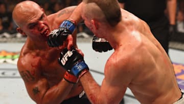 LAS VEGAS, NV - JULY 11: (R-L) Rory MacDonald punches Robbie Lawler in their UFC welterweight title fight during the UFC 189 event inside MGM Grand Garden Arena on July 11, 2015 in Las Vegas, Nevada. (Photo by Josh Hedges/Zuffa LLC/Zuffa LLC via Getty Images)