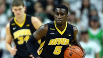 Jan 14, 2016; East Lansing, MI, USA; Iowa Hawkeyes guard Anthony Clemmons (5) brings the ball up court during the first half of a game against the Michigan State Spartans at Jack Breslin Student Events Center. Mandatory Credit: Mike Carter-USA TODAY Sports