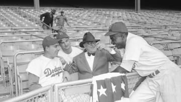 (Original Caption) The Dodgers at Yankee Stadium are shown with left to right Gil Hodges, Gene Hermanski, Branch Rickey, and Jackie Robinson, during the World Series.