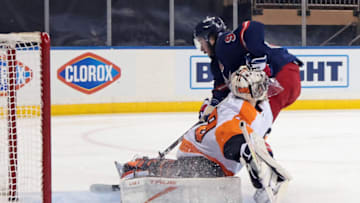 NEW YORK, NEW YORK - MARCH 17: Mika Zibanejad #93 of the New York Rangers scores a second period goal against Carter Hart #79 of the Philadelphia Flyers at Madison Square Garden on March 17, 2021 in New York City. (Photo by Bruce Bennett/Getty Images)