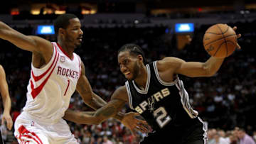 Nov 12, 2016; Houston, TX, USA; San Antonio Spurs forward Kawhi Leonard (2) handles the ball while Houston Rockets forward Trevor Ariza (1) defends during the second quarter at Toyota Center. Mandatory Credit: Erik Williams-USA TODAY Sports