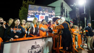 Aubie high fives fans during the inaugural Auburn basketball Tipoff at Toomers in Auburn, Ala., on Thursday, Oct. 17, 2019.