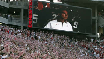 TUSCALOOSA, AL - SEPTEMBER 17: Fans cheer as coach Nick Saban leads the Alabama Crimson Tide out of the locker room for a game against North Texas on September 17, 2011 at Bryant-Denny Stadium in Tuscaloosa, Alabama. (Photo by Butch Dill/Getty Images)