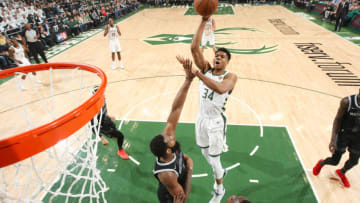 MILWAUKEE, WI - APRIL 14: Giannis Antetokounmpo #34 of the Milwaukee Bucks drives through the paint during the game against the Detroit Pistons during Game One of Round One of the 2019 NBA Playoffs on April 14, 2019 at the Fiserv Forum in Milwaukee, Wisconsin. NOTE TO USER: User expressly acknowledges and agrees that, by downloading and or using this photograph, user is consenting to the terms and conditions of the Getty Images License Agreement. Mandatory Copyright Notice: Copyright 2019 NBAE (Photo by Gary Dineen/NBAE via Getty Images)