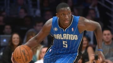 Mar 23, 2014; Los Angeles, CA, USA; Orlando Magic guard Victor Oladipo (5) dribbles the ball against the Los Angeles Lakers at Staples Center. Mandatory Credit: Kirby Lee-USA TODAY Sports