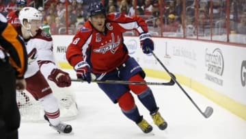 Nov 2, 2014; Washington, DC, USA; Washington Capitals left wing Alex Ovechkin (8) skates with the puck as Arizona Coyotes defenseman Connor Murphy (5) chases in the third period at Verizon Center. The Coyotes won 6-5. Mandatory Credit: Geoff Burke-USA TODAY Sports