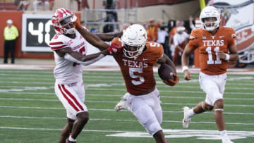 Sep 4, 2021; Austin, Texas, USA; Texas Longhorns running back Bijan Robinson (5) outruns Louisiana Ragin' Cajuns cornerback AJ Washington (16) as quarterback Casey Thompson (11) looks on in the second half at Darrell K Royal-Texas Memorial Stadium. Mandatory Credit: Scott Wachter-USA TODAY Sports