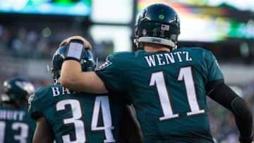 Sep 25, 2016; Philadelphia, PA, USA; Philadelphia Eagles quarterback Carson Wentz (11) and running back Kenjon Barner (34) celebrate a touchdown against the Pittsburgh Steelers during the third quarter at Lincoln Financial Field. Mandatory Credit: Bill Streicher-USA TODAY Sports