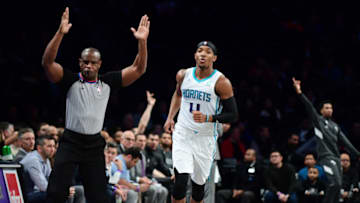 NEW YORK, NEW YORK - DECEMBER 11: Devonte' Graham #4 of the Charlotte Hornets reacts to a basket during the first half of their game against the Brooklyn Nets at Barclays Center on December 11, 2019 in New York City. NOTE TO USER: User expressly acknowledges and agrees that, by downloading and or using this photograph, User is consenting to the terms and conditions of the Getty Images License Agreement. (Photo by Emilee Chinn/Getty Images)