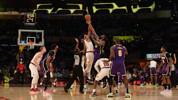 LOS ANGELES, CALIFORNIA - OCTOBER 29: Jarrett Allen #31 of the Cleveland Cavaliers and DeAndre Jordan #10 of the Los Angeles Lakers during the opening tip-off at Staples Center on October 29, 2021 in Los Angeles, California. NOTE TO USER: User expressly acknowledges and agrees that, by downloading and/or using this Photograph, user is consenting to the terms and conditions of the Getty Images License Agreement. (Photo by Ronald Martinez/Getty Images)
