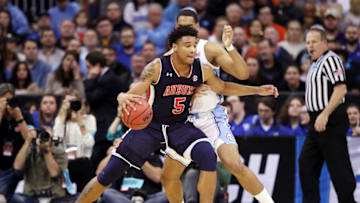 KANSAS CITY, MISSOURI - MARCH 29: Chuma Okeke #5 of the Auburn Tigers handles the ball against Garrison Brooks #15 of the North Carolina Tar Heels during the 2019 NCAA Basketball Tournament Midwest Regional at Sprint Center on March 29, 2019 in Kansas City, Missouri. (Photo by Christian Petersen/Getty Images)