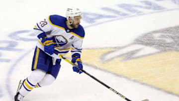 Dec 17, 2021; Pittsburgh, Pennsylvania, USA; Buffalo Sabres left wing Zemgus Girgensons (28) skates with the puck against the Pittsburgh Penguins during the second period at PPG Paints Arena. Mandatory Credit: Charles LeClaire-USA TODAY Sports