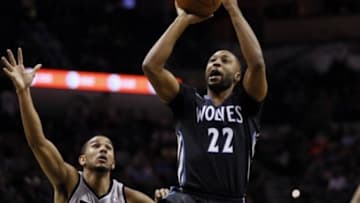Jan 12, 2014; San Antonio, TX, USA; Minnesota Timberwolves guard A.J. Price (22) drives to the basket past San Antonio Spurs guard Cory Joseph (left) during the second half at AT&T Center. The Spurs won 104-86. Mandatory Credit: Soobum Im-USA TODAY Sports