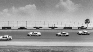 DAYTONA BEACH, FL - JULY 4: Slick Johnson drives the #40 Buick Regal ahead of Geoff Bodine in the #50 Pontiac Lemans, Terry Labonte in the #44 Buick Regal, and Cale Yarborough in the #27 Buick Regal during the Firecracker 400 NASCAR race, Daytona International Speedway, Daytona Beach , FL, July 4,1982. (Photo by Brian Cleary/Getty Images)