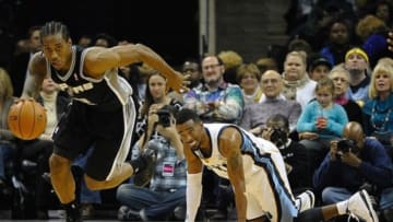 Nov 22, 2013; Memphis, TN, USA; San Antonio Spurs small forward Kawhi Leonard (20) steals the ball from Memphis Grizzlies point guard Mike Conley (11) during the second quarter at FedExForum. Mandatory Credit: Justin Ford-USA TODAY Sports