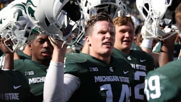 EAST LANSING, MI - SEPTEMBER 29: Brian Lewerke #14 of the Michigan State Spartans celebrates a 31-20 win over the Central Michigan Chippewas at Spartan Stadium on September 29, 2018 in East Lansing, Michigan. (Photo by Gregory Shamus/Getty Images)