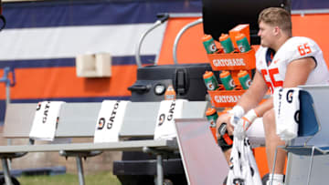 Sep 11, 2021; Charlottesville, Virginia, USA; Illinois Fighting Illini offensive lineman Doug Kramer (65) sits on the bench against the Virginia Cavaliers in the fourth quarter at Scott Stadium. Mandatory Credit: Geoff Burke-USA TODAY Sports