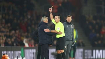 SOUTHAMPTON, ENGLAND - JANUARY 01: Match Referee Mike Dean shows a yellow card to Jose Mourinho, Manager of Tottenham Hotspur during the Premier League match between Southampton FC and Tottenham Hotspur at St Mary's Stadium on January 01, 2020 in Southampton, United Kingdom. (Photo by Michael Steele/Getty Images)