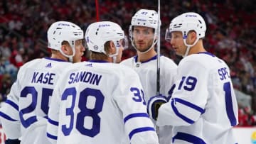 Oct 25, 2021; Raleigh, North Carolina, USA; Toronto Maple Leafs center Jason Spezza (19) talks to defenseman Rasmus Sandin (38) right wing Ondrej Kase (25) and left wing Pierre Engvall (47) during the second period against the Carolina Hurricanes at PNC Arena. Mandatory Credit: James Guillory-USA TODAY Sports