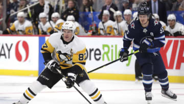 Pittsburgh Penguins, Sidney Crosby (87); Winnipeg Jets, Mark Scheifele (55). Mandatory Credit: James Carey Lauder-USA TODAY Sports