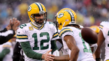 EAST RUTHERFORD, NEW JERSEY - DECEMBER 01: Aaron Rodgers #12 of the Green Bay Packers congratulates teammate Davante Adams #17 after Adams scored a touchdown in the first quarter against the New York Giants at MetLife Stadium on December 01, 2019 in East Rutherford, New Jersey. (Photo by Elsa/Getty Images)