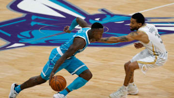 CHARLOTTE, NORTH CAROLINA - JANUARY 13: Terry Rozier #3 of the Charlotte Hornets drives to the basket against Trey Burke #3 of the Dallas Mavericks during the second quarter of their game at Spectrum Center on January 13, 2021 in Charlotte, North Carolina. NOTE TO USER: User expressly acknowledges and agrees that, by downloading and or using this photograph, User is consenting to the terms and conditions of the Getty Images License Agreement. (Photo by Jared C. Tilton/Getty Images)