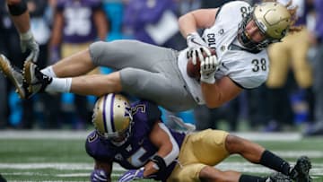 SEATTLE, WA - OCTOBER 20: Defensive back Myles Bryant #5 of the Washington Huskies tackles Brady Russell #38 of the Colorado Buffaloes at Husky Stadium on October 20, 2018 in Seattle, Washington. (Photo by Otto Greule Jr/Getty Images)