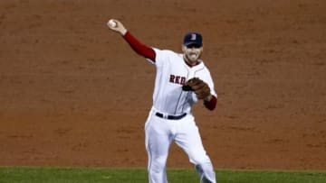 Oct 30, 2013; Boston, MA, USA; Boston Red Sox shortstop Stephen Drew (7) throws to first base against the St. Louis Cardinals during the fifth inning of game six of the MLB baseball World Series at Fenway Park. Mandatory Credit: Mark L. Baer-USA TODAY Sports