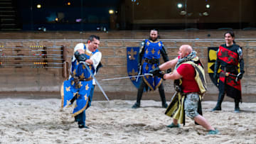 Buddy Valastro and Duff Goldman with Medieval Times cast members, as seen on Buddy vs Duff, Season 2. photo provided by Food Network