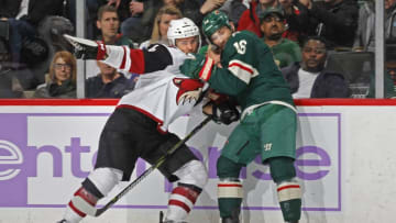 ST. PAUL, MN - NOVEMBER 27: Niklas Hjalmarsson #4 of the Arizona Coyotes and Jason Zucker #16 of the Minnesota Wild tie-up during a game at Xcel Energy Center on November 27, 2018 in St. Paul, Minnesota. The Coyotes defeated the Wild 4-3.(Photo by Bruce Kluckhohn/NHLI via Getty Images)