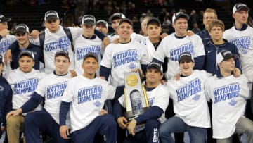 NEW YORK, NY - MARCH 19: Nico Megaludis (L), Zain Retherford (C) and Morgan McIntosh of the Penn State Nittany Lions pose with the first place team trophy after the finals of the NCAA Wrestling Championships on March 19, 2016 at Madison Square Garden in New York, New York. (Photo by Hunter Martin/Getty Images)