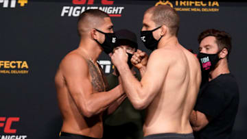 LAS VEGAS, NEVADA - DECEMBER 18: In this handout image provided by UFC, (L-R) Opponents Anthony Pettis and Alex Morono face off during the UFC Fight Night weigh-in at UFC APEX on December 18, 2020 in Las Vegas, Nevada. (Photo by Cooper Neill/Zuffa LLC via Getty Images)