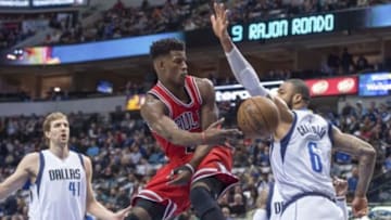 Jan 23, 2015; Dallas, TX, USA; Chicago Bulls guard Jimmy Butler (21) passes around Dallas Mavericks center Tyson Chandler (6) during the first quarter at the American Airlines Center. Mandatory Credit: Jerome Miron-USA TODAY Sports